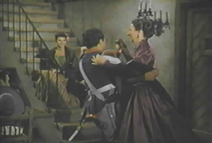 Corporal Reyes dances with Dolores Bastinado.