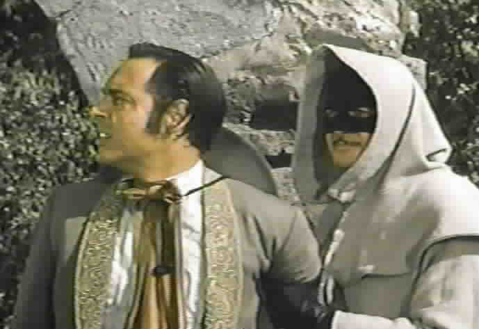 Zorro disguises himself as a priest and uses Serrano as a shield.