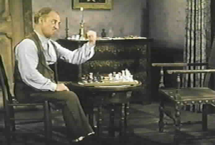 Bernardo threatens his imaginary chess opponent.