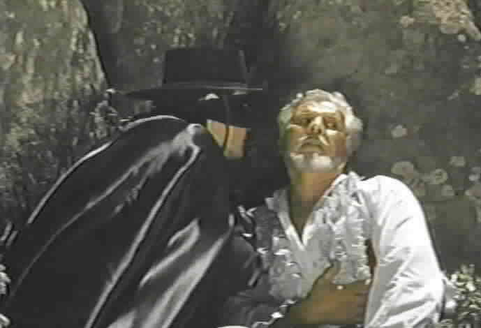 Zorro tries to keep the soldiers from discovering him and Don Alejandro.