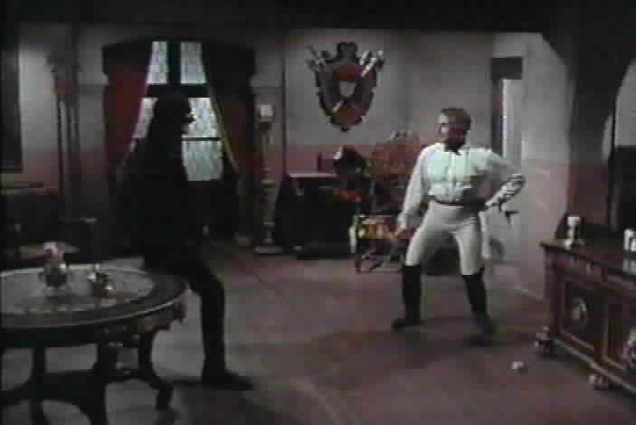 Don Esteban and Zorro duel.