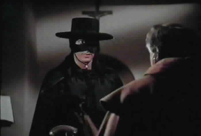 Zorro gives the stolen tax money to Fray Felipe.