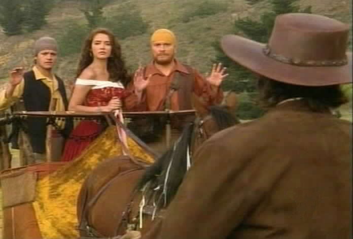 Diego confronts the gypsies as they bring Esmeralda home.