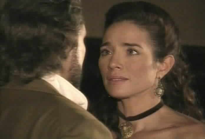 Almudena reacts as Alejandro tells her that he loves her.