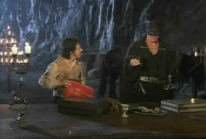 Zorro gives Bernardo directions for distributing the tax money.