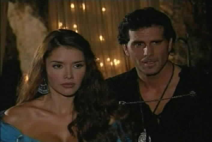 As Esmeralda listens, Diego gives Bernardo directions for his mission.