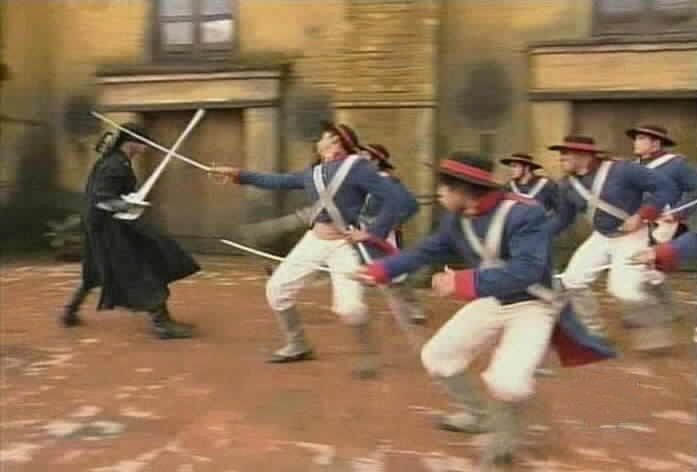 Zorro fights a group of soldiers.