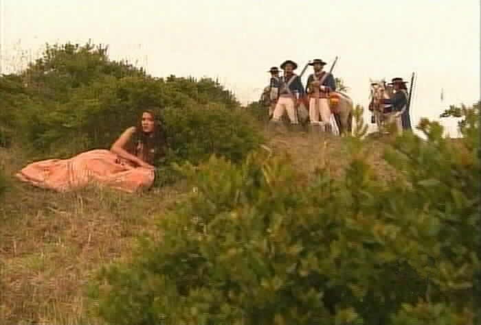 Esmeralda hides from the soldiers.