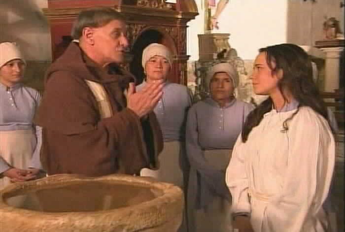 Padre Tomas baptizes Suplicios.