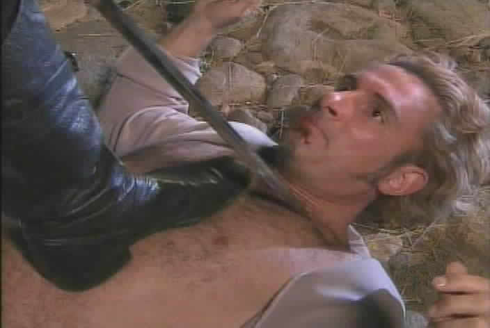Zorro prepares to cut a Z on Montero's chest.