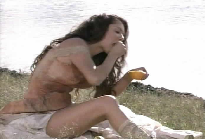 Esmeralda eats by the lake.