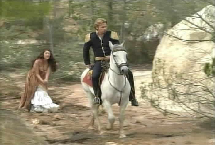 Montero pulls Esmeralda along, tied to his horse.