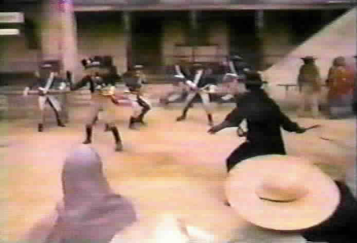 Zorro fights the soldiers during the rescue of Brother Napa.
